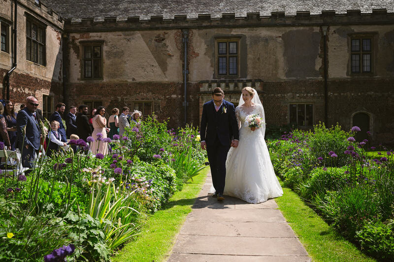 Bride and groom on the pathway aisle